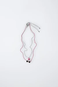 PACK OF TWO DICE AND STAR NECKLACES