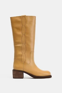 BOTTES EN CUIR AVEC SURPIQÛRES