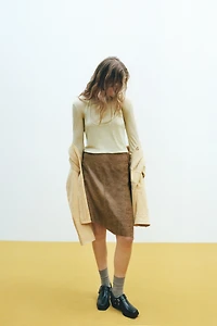 ASYMMETRIC LEATHER MIDI SKIRT
