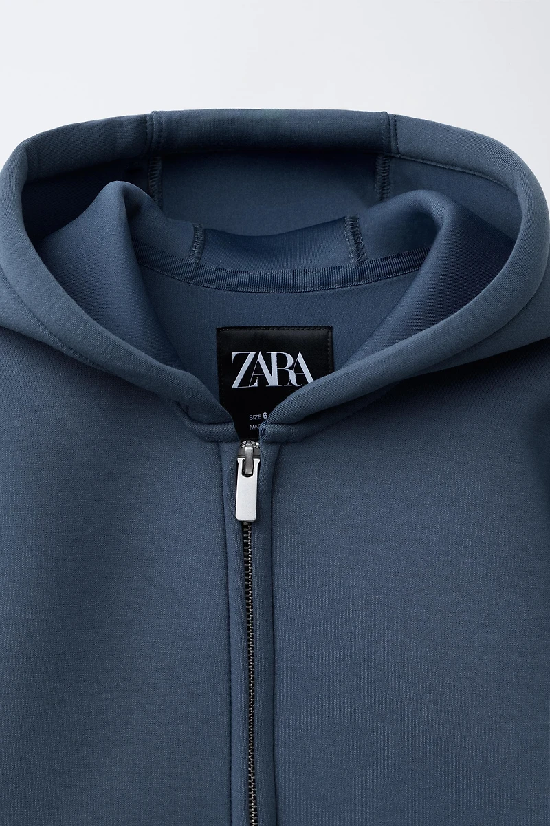 VESTE EFFET NÉOPRÈNE ÉTIQUETTE