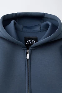 VESTE EFFET NÉOPRÈNE ÉTIQUETTE