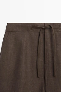 Faded total look linen trousers
