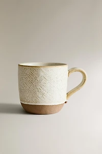 MUG WITH RAISED DESIGN