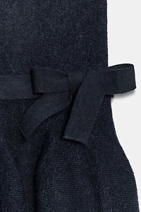 TOP EN MAILLE PÉPLUM AVEC NŒUD