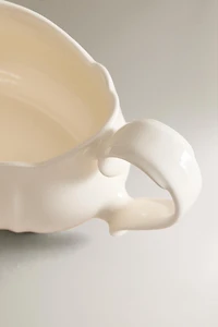 EARTHENWARE GRAVY BOAT WITH RAISED-EDGE DETAIL