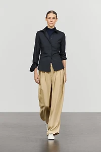 Flowing pleated pants with button detail