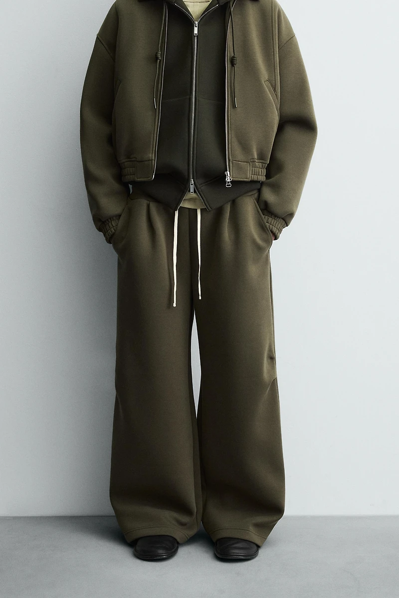 WIDE FIT NEOPRENE EFFECT PANTS WITH STUDS