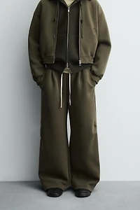 WIDE FIT NEOPRENE EFFECT PANTS WITH STUDS