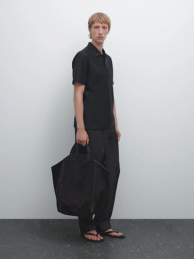 Polo texturé bouton dissimulé