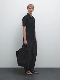 Polo texturé bouton dissimulé