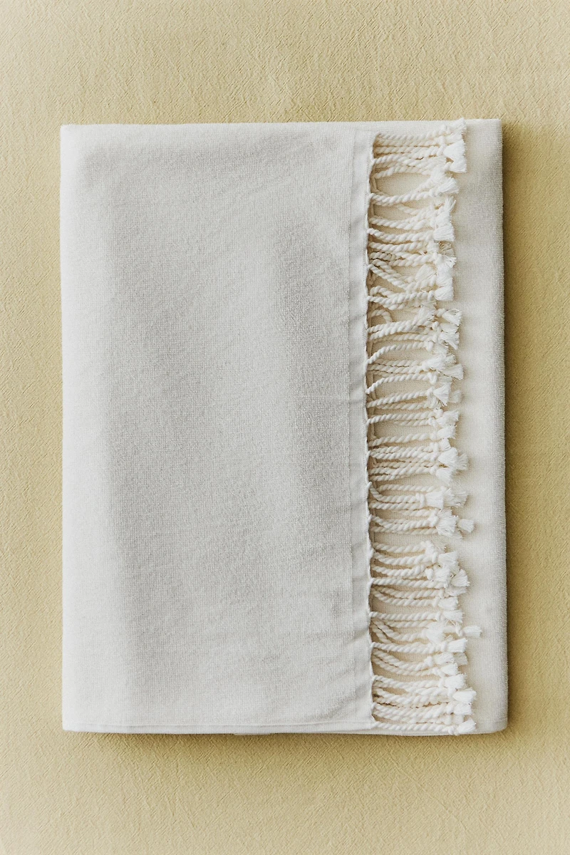 COTTON BEACH TOWEL WITH FRINGE