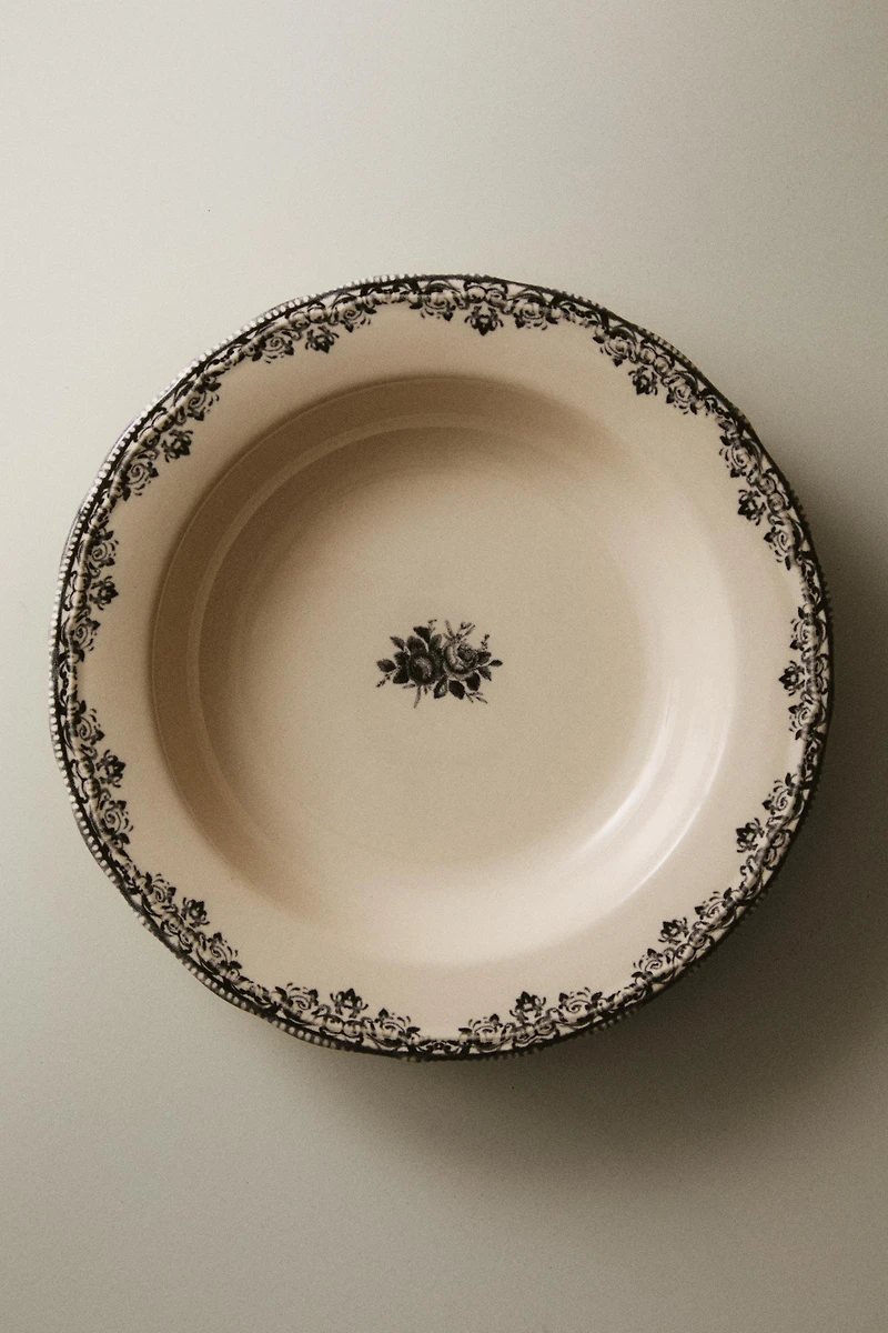 EARTHENWARE SOUP PLATE WITH PLACED DESIGN
