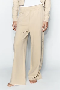 WASHED EFFECT FLEECE PANTS WITH STUDS