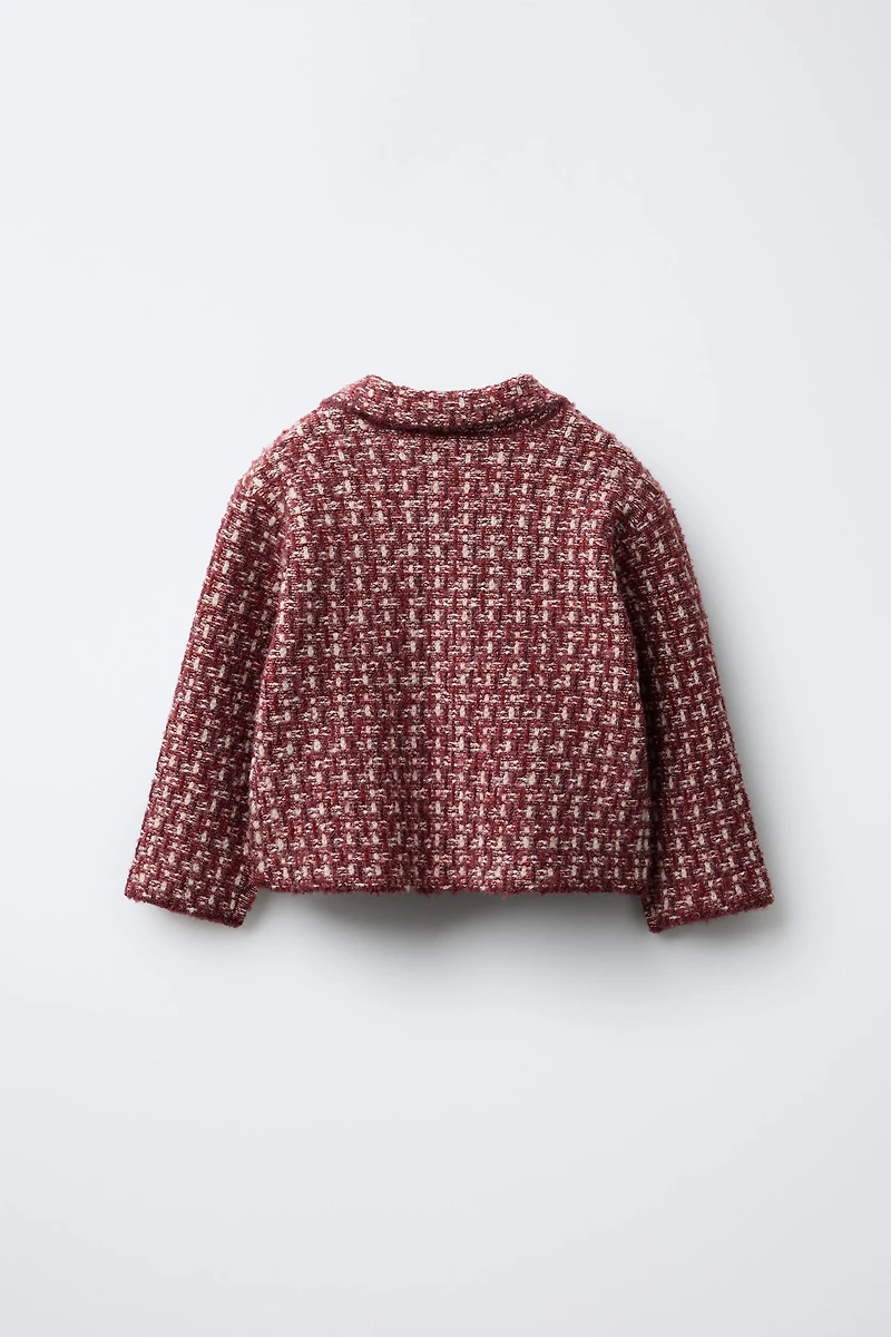 GILET EN MAILLE À NŒUD