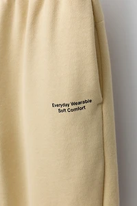 JOGGING PANTS WITH TEXT PRINT