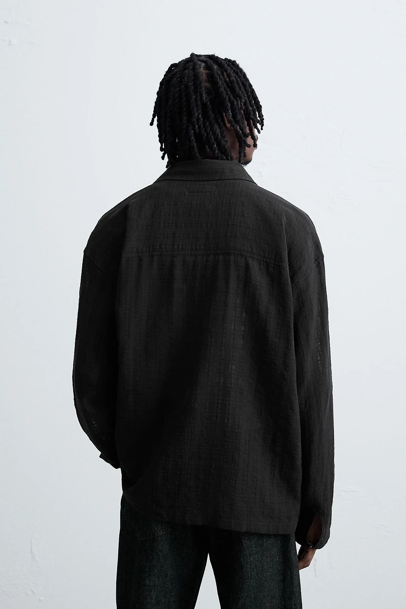 CHEMISE POLO STRUCTURÉE SEMI-TRANSPARENTE