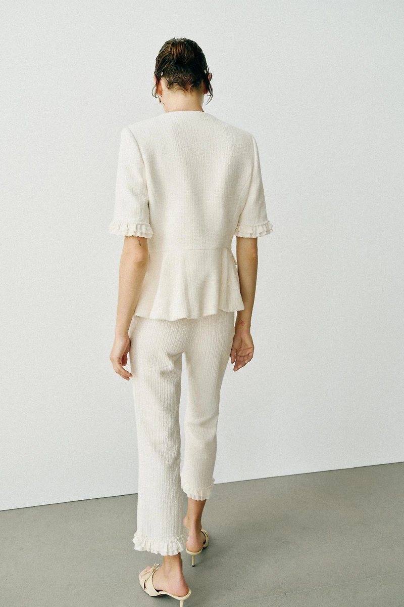 VESTE PEPLUM À VOLANTS ET MANCHES COURTES