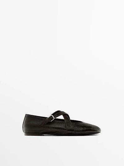 Ballet flats with criss-cross straps and buckle