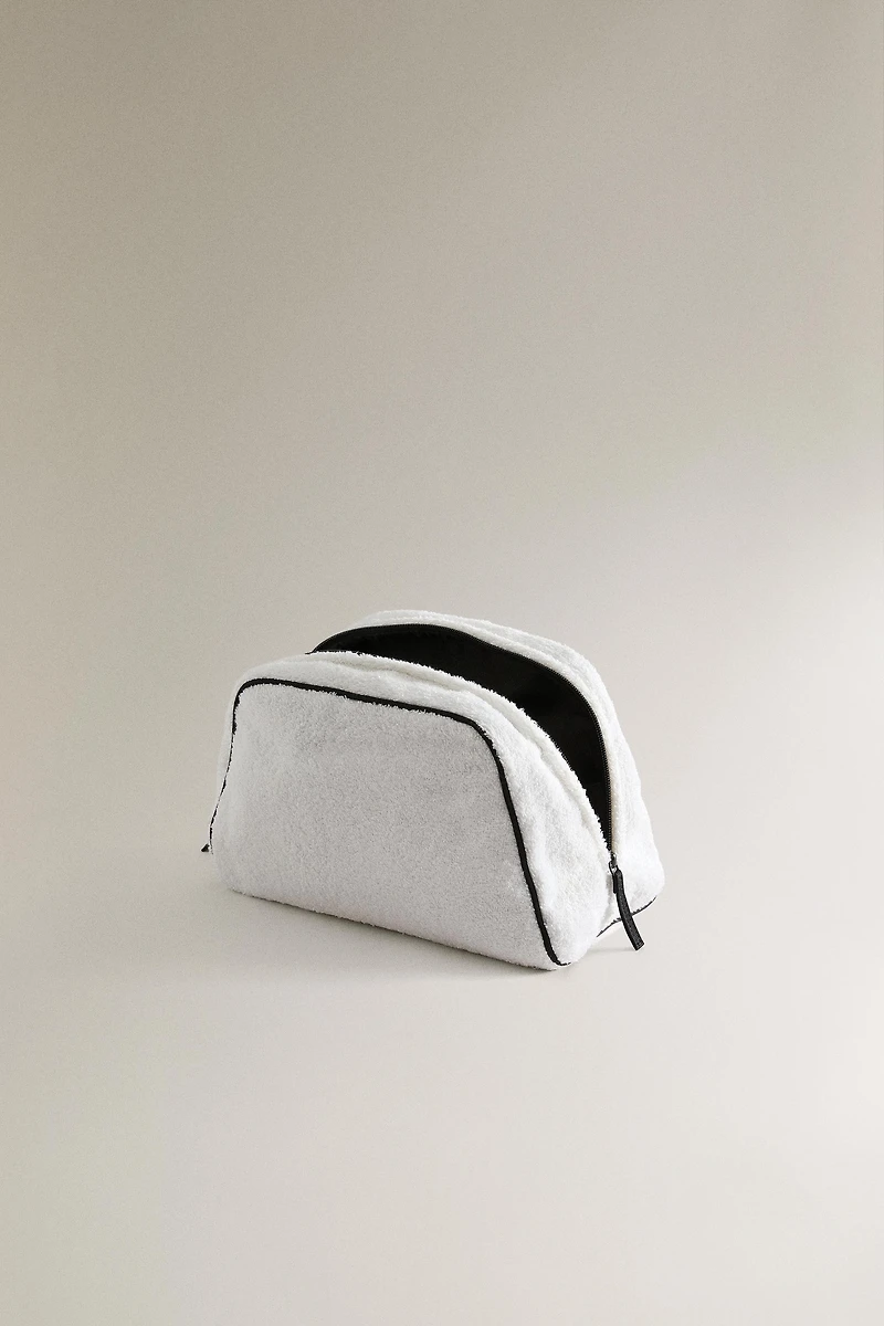 TERRY CLOTH TOILETRY BAG WITH PIPING DETAIL