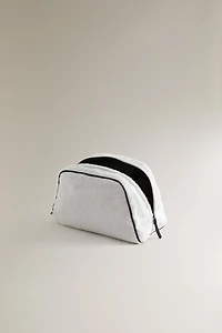 TERRY CLOTH TOILETRY BAG WITH PIPING DETAIL