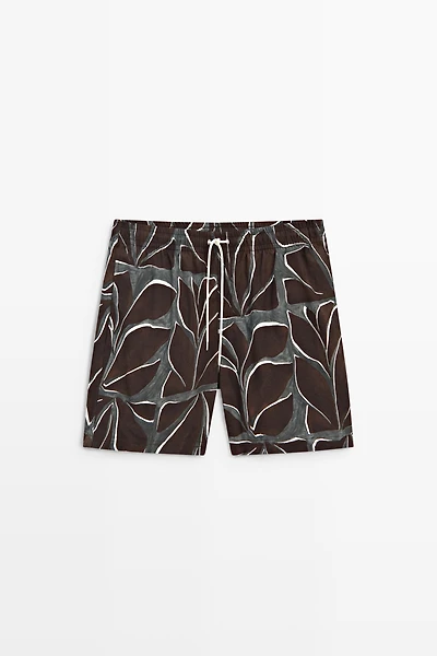 Tropical print swimming trunks
