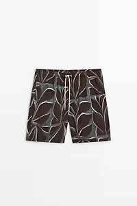 Tropical print swimming trunks