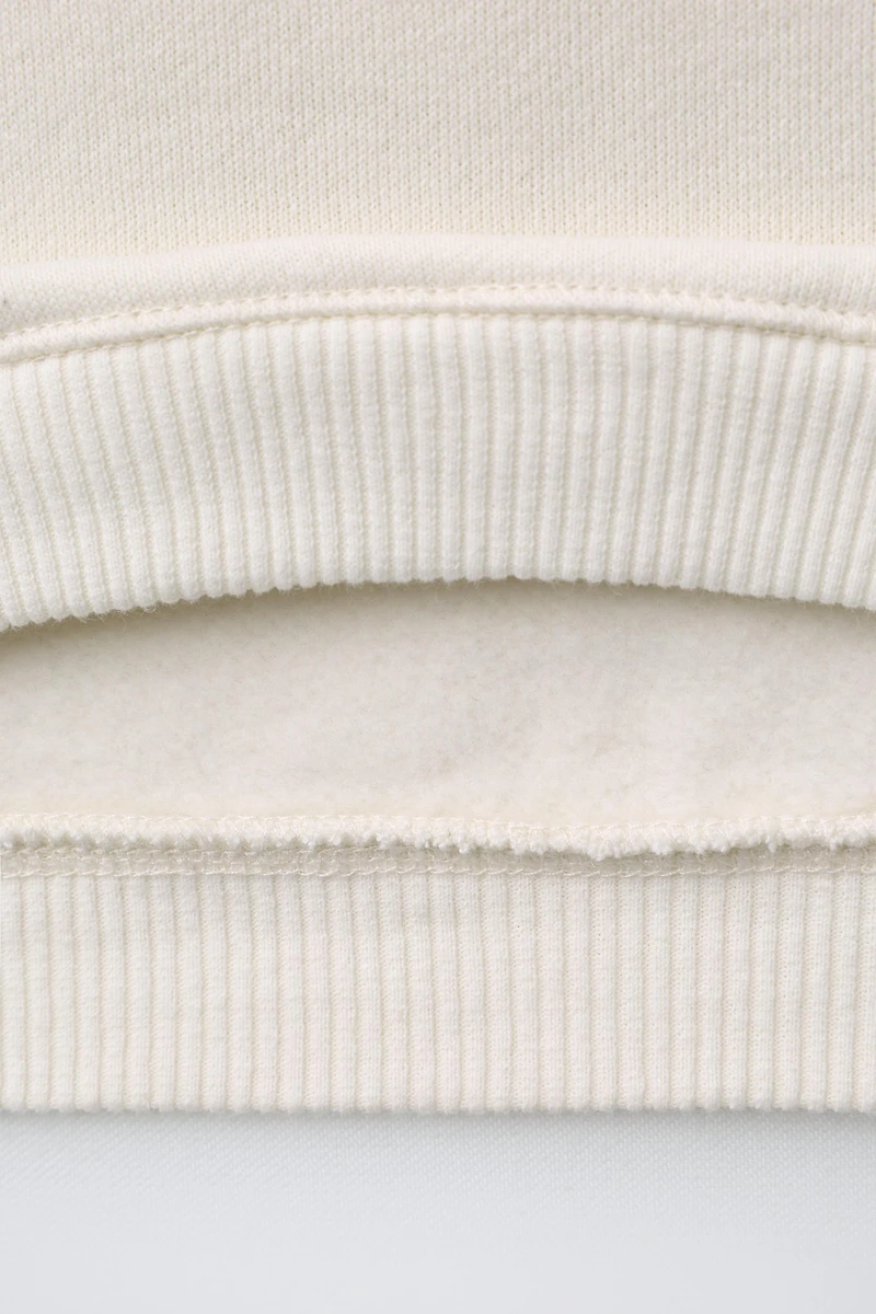 TEXT RAGLAN SLEEVE SWEATSHIRT