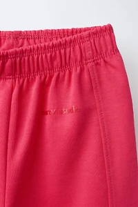 PANTALON WIDE LEG INTERLOCK INSCRIPTION EN RELIEF