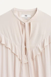 BLOUSE À NŒUD ET VOLANTS ÉDITION LIMITÉE