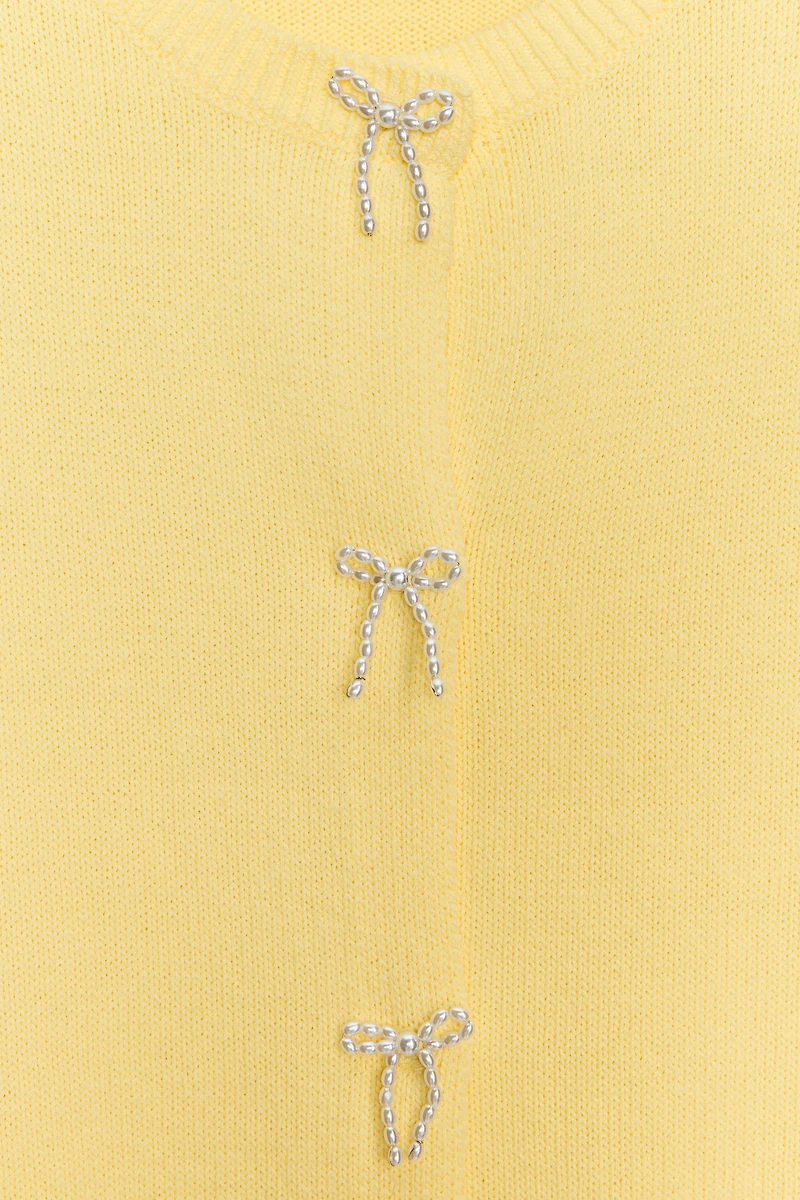 GILET EN MAILLE LACETS PERLES