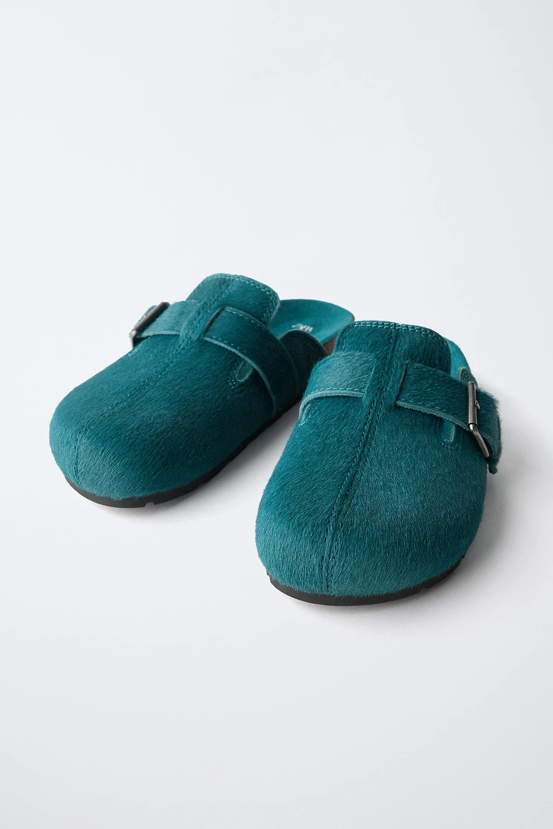 SABOTS EN CUIR À BOUCLE