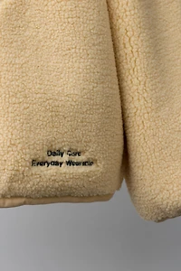 ZIP FAUX SHEARLING SWEATSHIRT