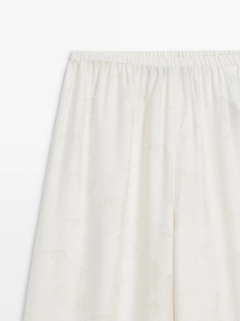 Flowing stretch trousers with fabric detail