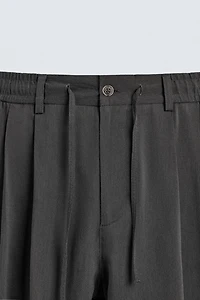 FLOWY PLEATED PANTS