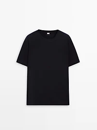 Short sleeve pyjama top and striped trousers