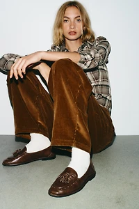 MOCASSINS À POMPONS EN CUIR