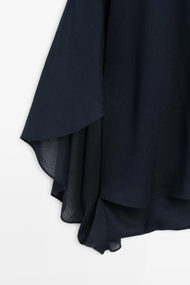 Asymmetric flowing cape