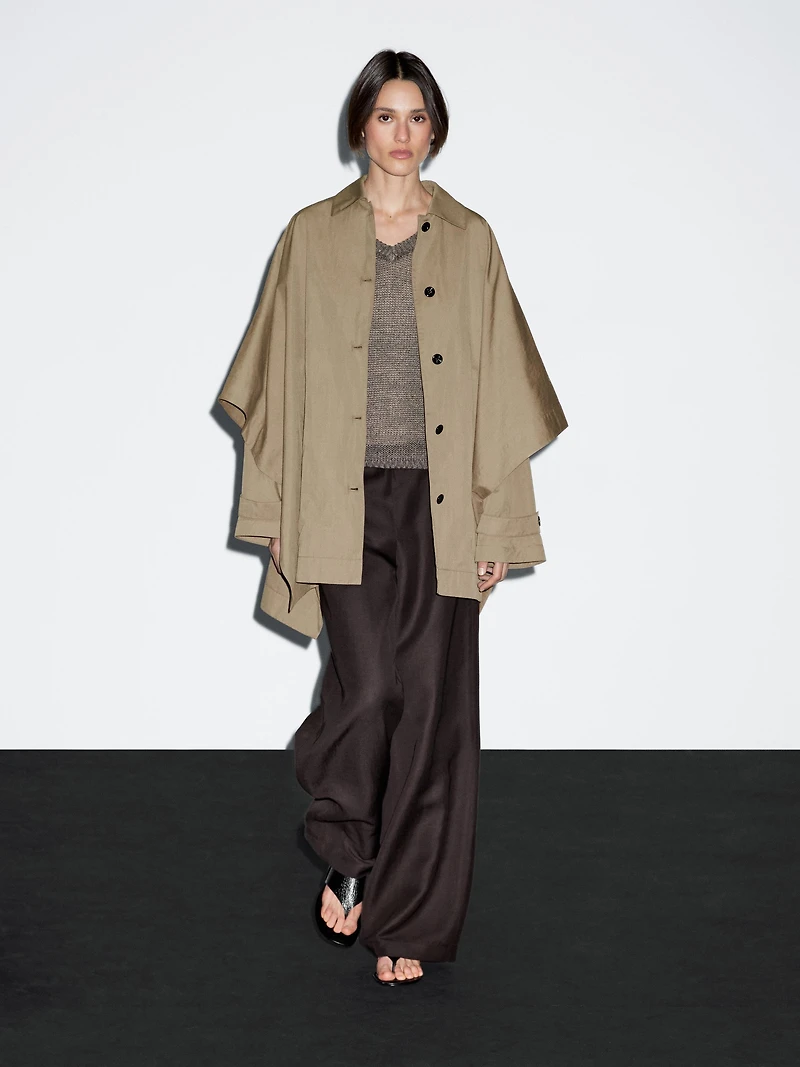 Cape trench coat with long sleeves