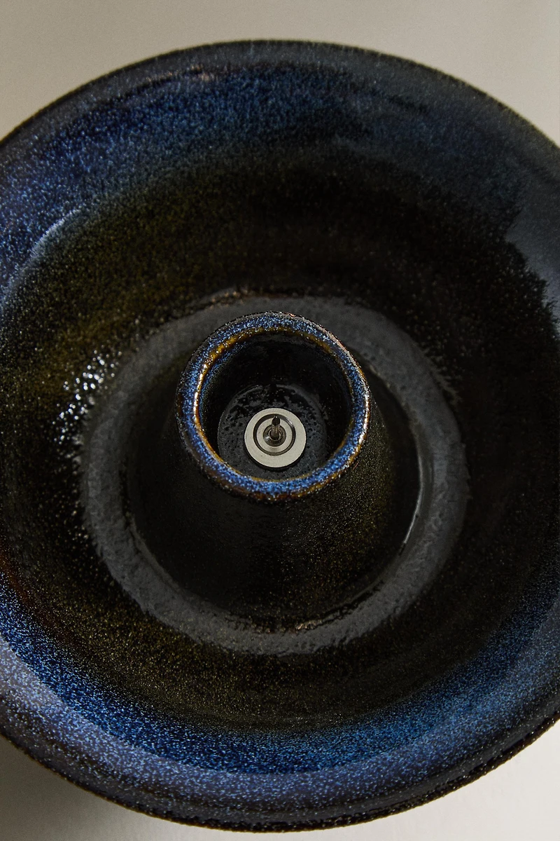 IRON AND STONEWARE CANDLEHOLDER