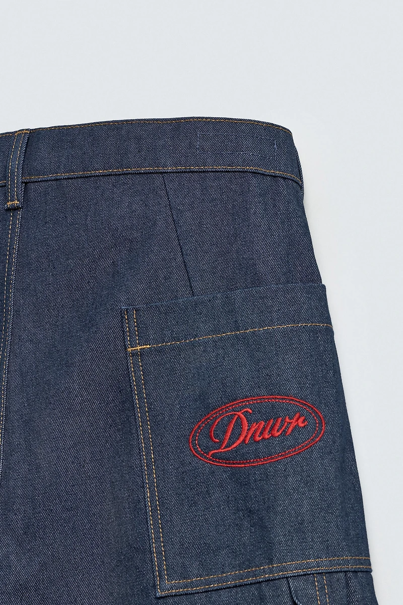 JORTS EN DENIM AVEC POCHE BRODÉE