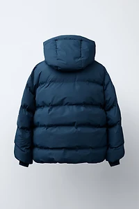 MANTEAU REMBOURRÉ ÉTIQUETTE DÉPERLANT