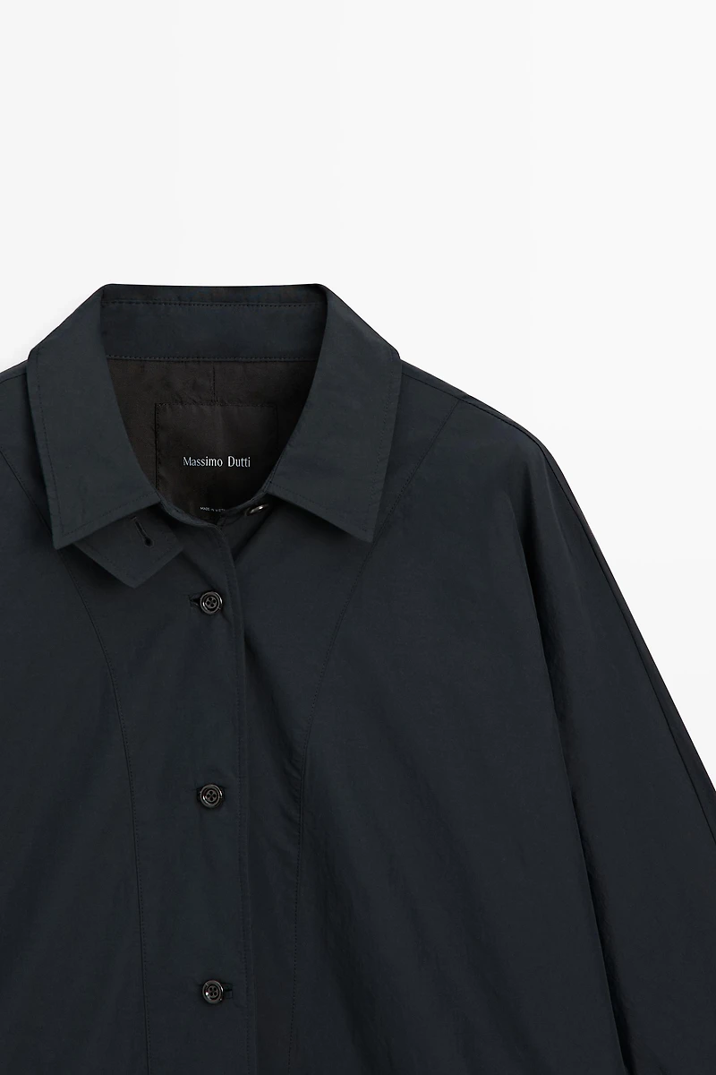 Jacket with buttoned collar strap