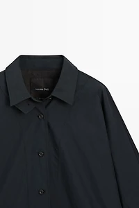 Jacket with buttoned collar strap