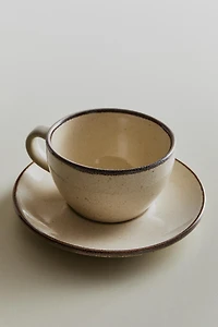 STONEWARE TEACUP AND SAUCER