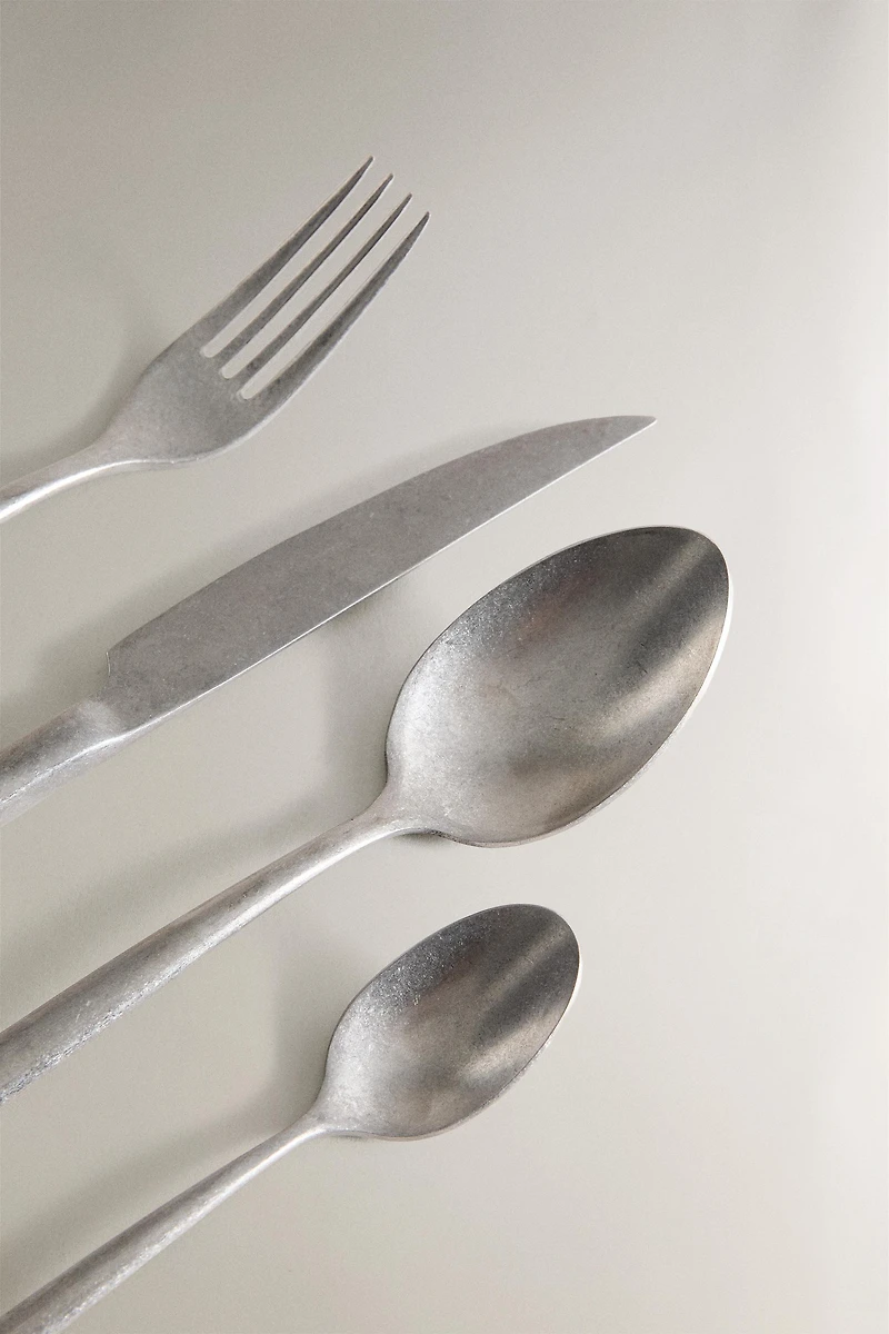 4-PIECE VINTAGE STEEL FLATWARE SET