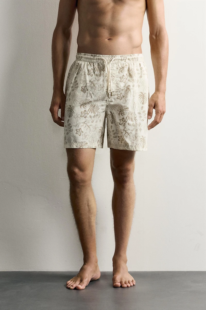 LONG FLORAL PRINT SWIM SHORTS