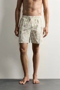 LONG FLORAL PRINT SWIM SHORTS