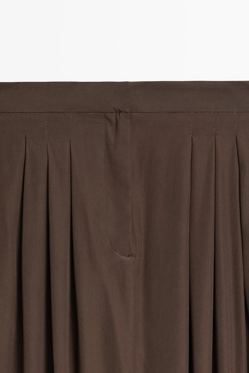 Flowing midi skirt with pleat detail