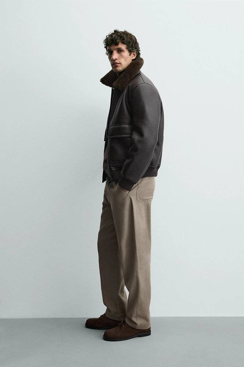 BLOUSON EN MATIÈRE SYNTHÉTIQUE AVEC COL BIMATIÈRE