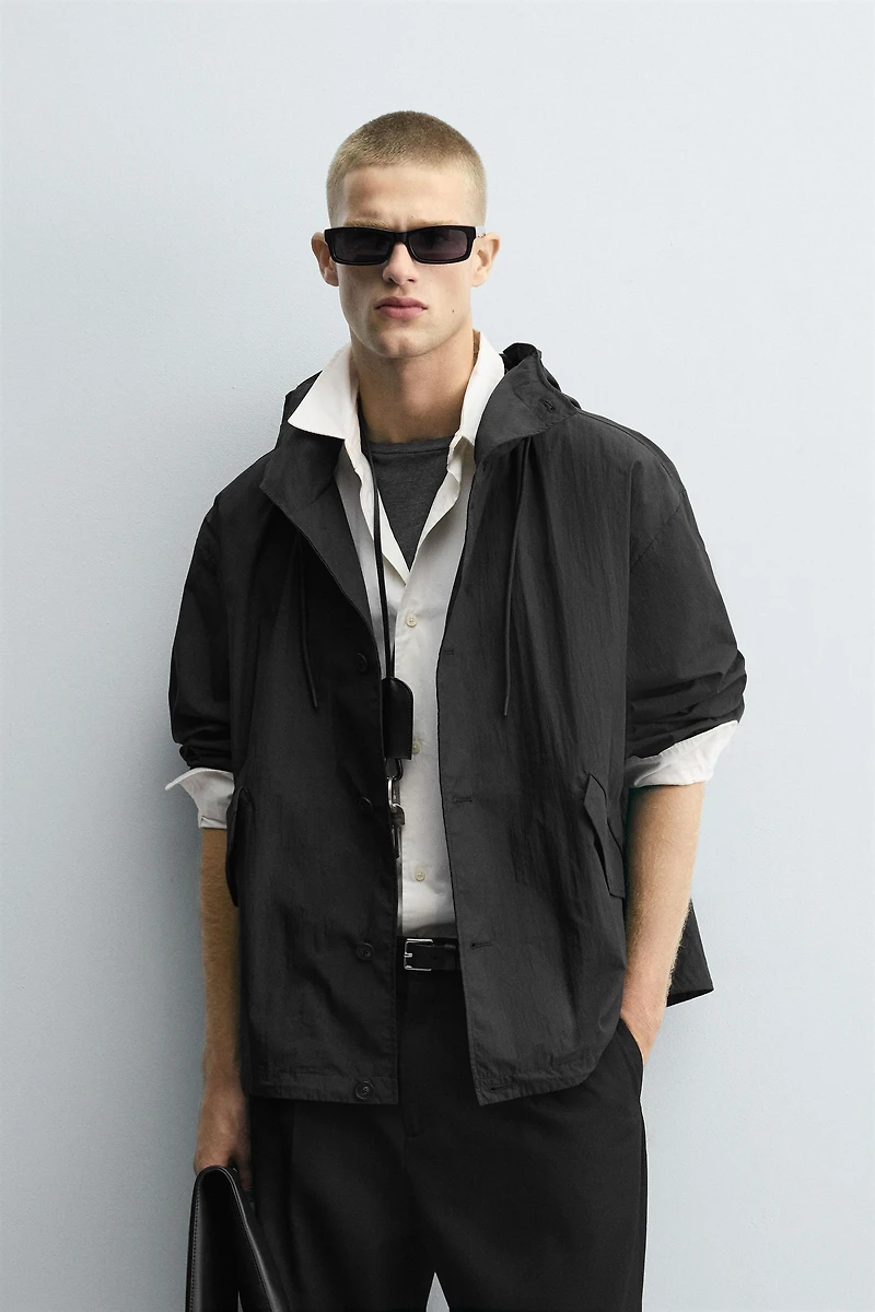 BLOUSON TECHNIQUE À CAPUCHE